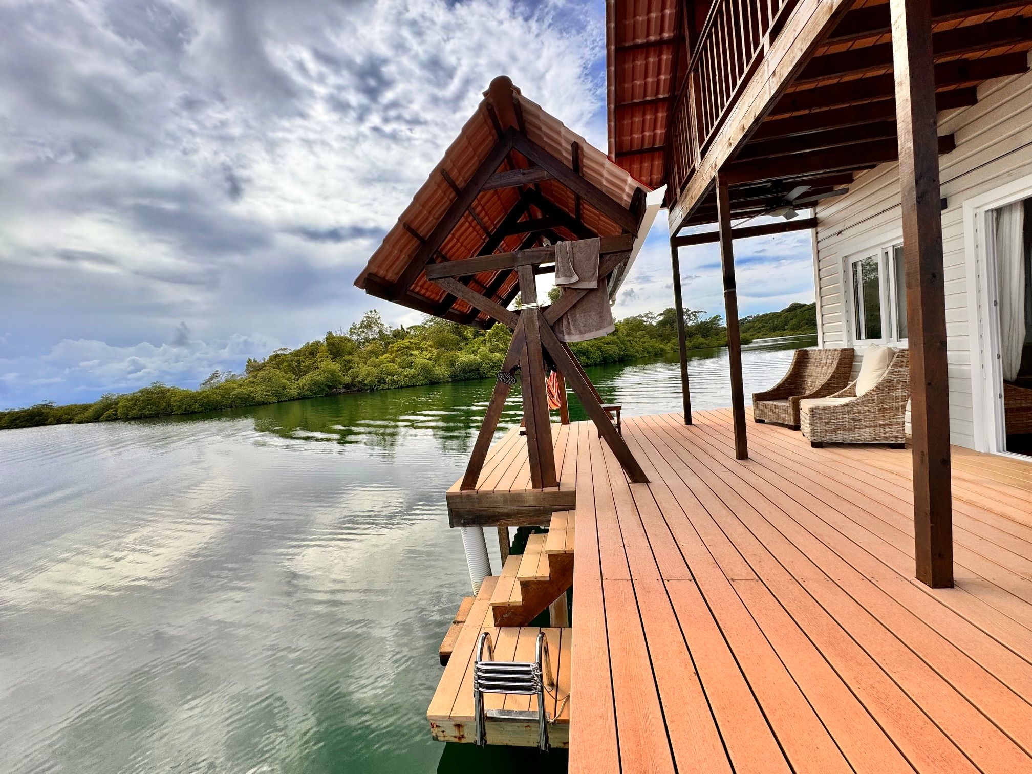 The terrace of El Tulipán Perdido, with the steps and ladder into the water