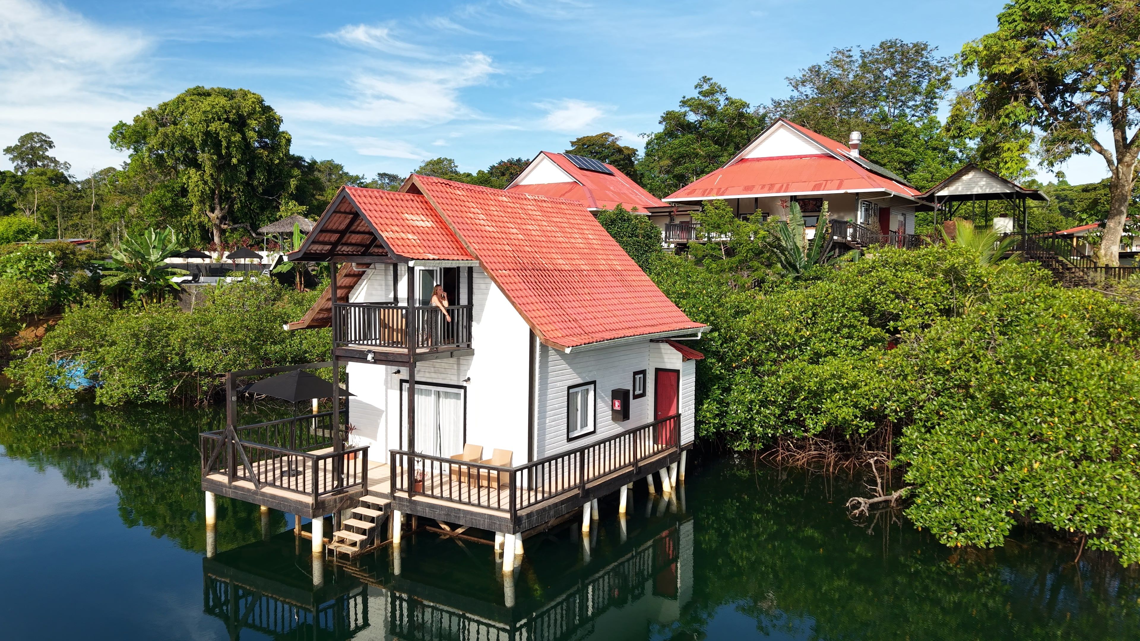 Casa del Mar from the air: the terrace, the balcony and the red tile roof over the lagoon