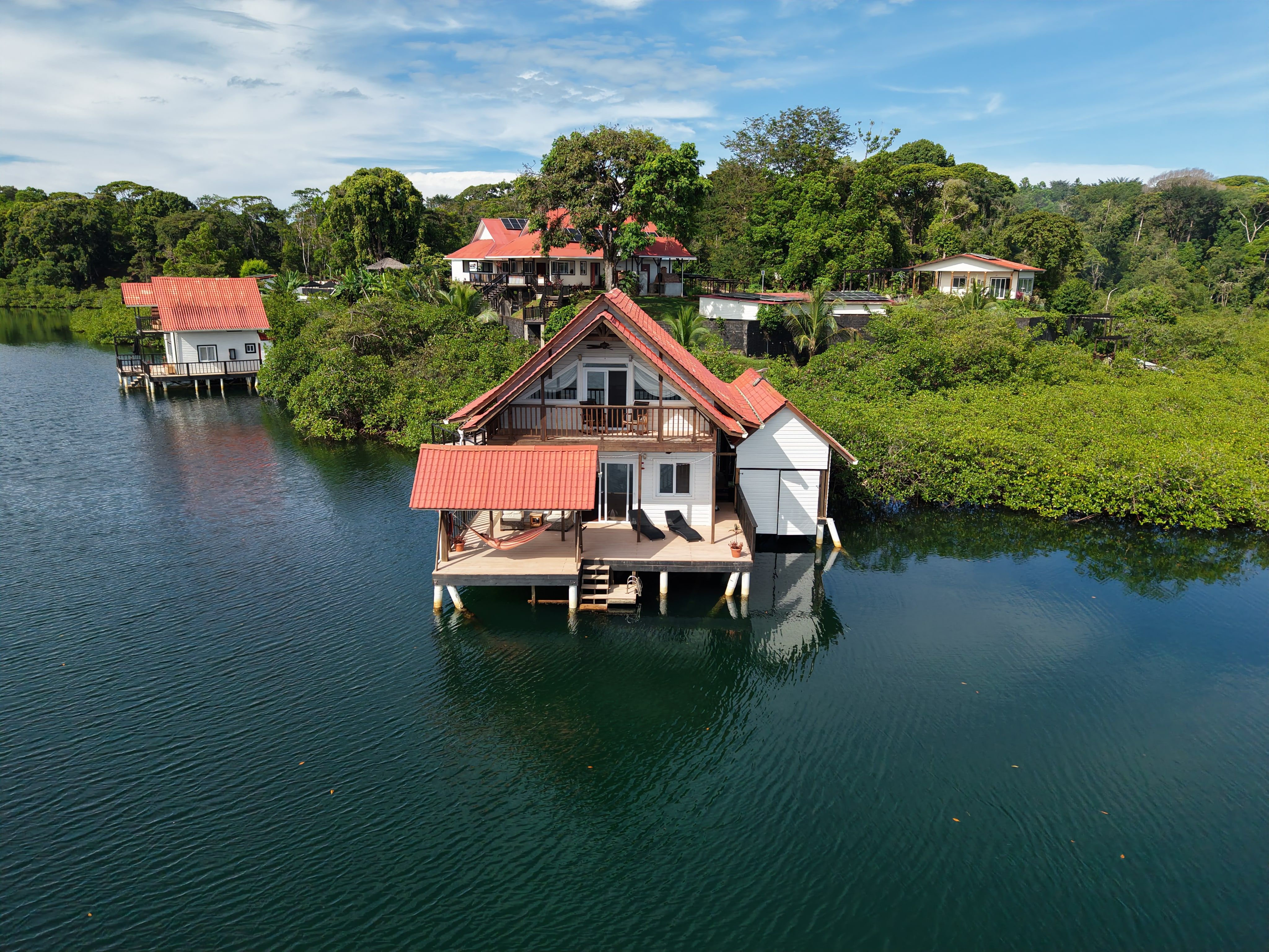 El Tulipán Perdido from the air, with Casa del Mar to the left and the rest of the resort behind, among the trees