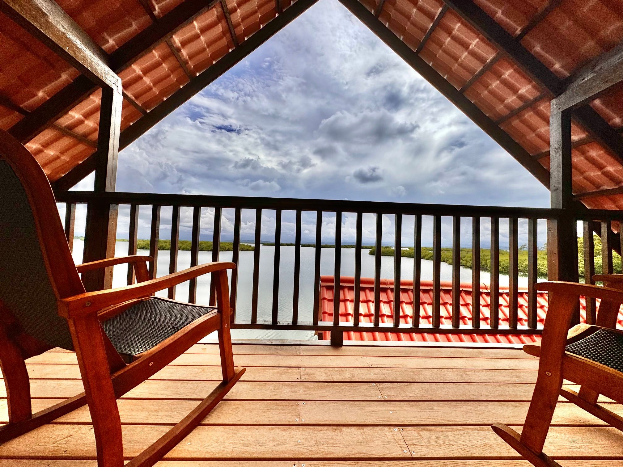 Rocking chairs on the upstairs balcony, facing the lagoon