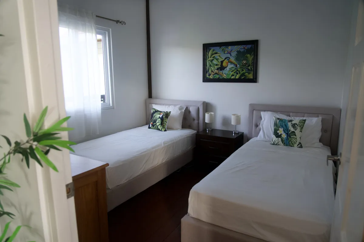 The second bedroom, with two single beds