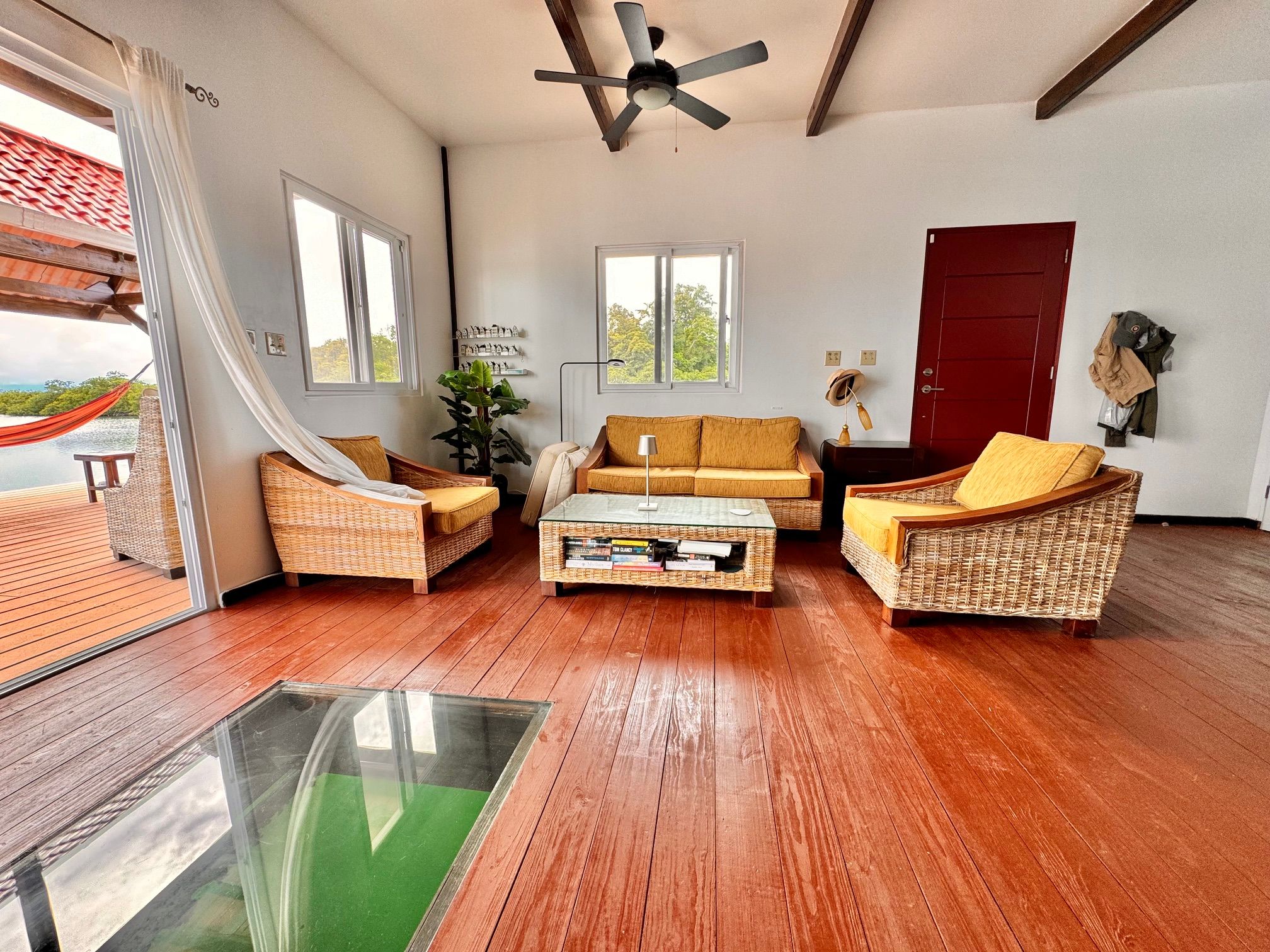 The living room, with a glass floor panel over the water